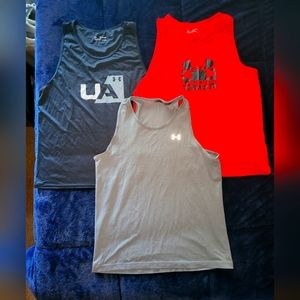 Under Armour tank tops. Near new ! 3 Tanks
